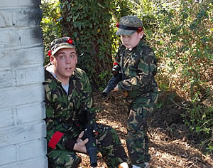 adult and child enjoying laser combat